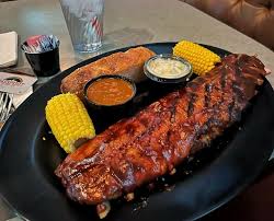 Ellis Island Hotel, Casino & Brewery (Village Pub & Cafe) signature dishes  Famous Steak Special (often includes steak, potato, green beans, and a beer), BBQ Ribs or Chicken, Prime Rib.